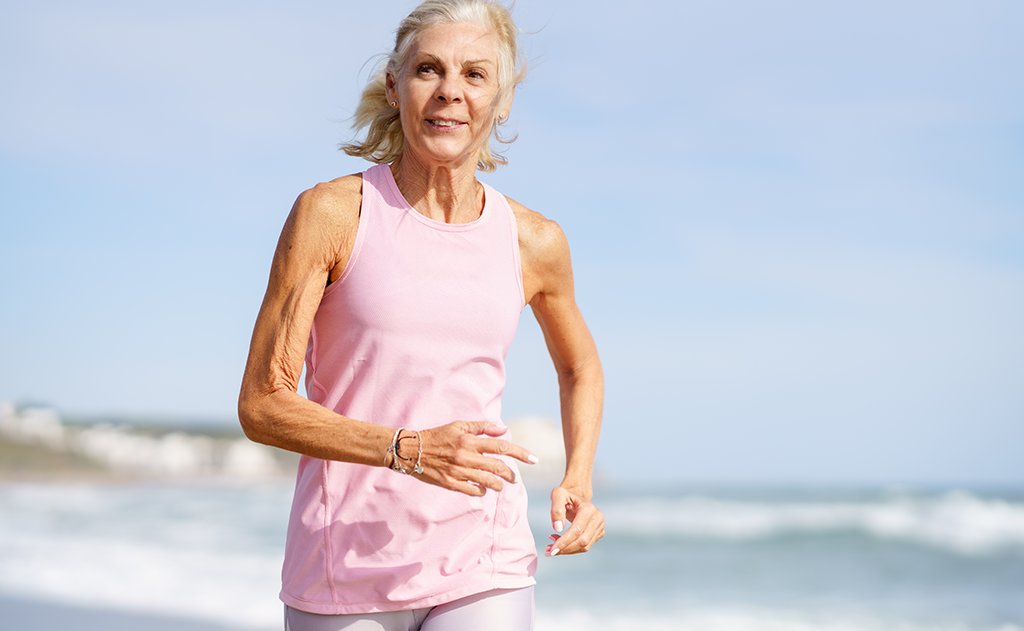 Is It Possible to Reverse Your Age?, image of an older woman running on the beach