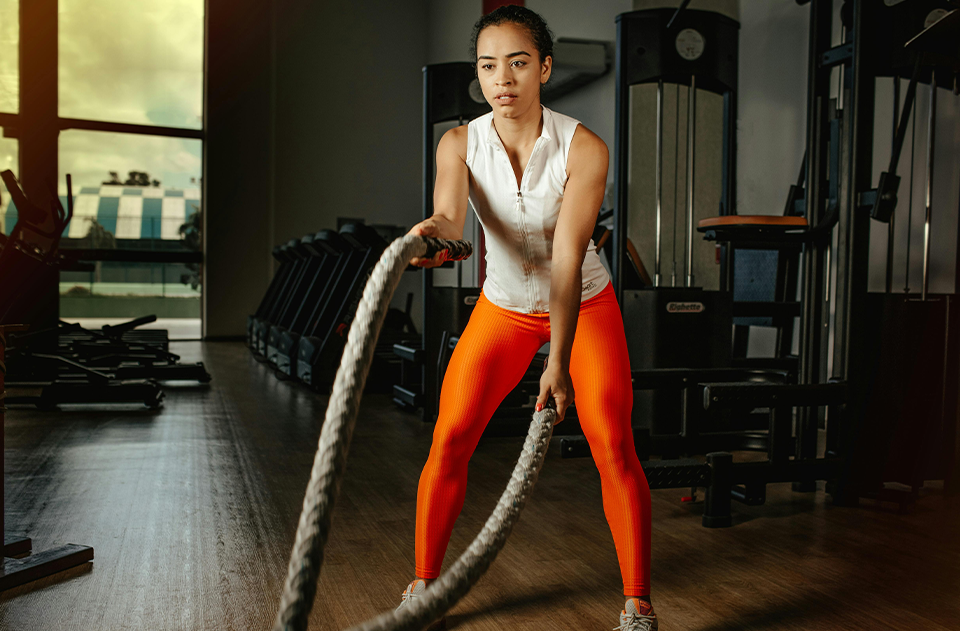 Testosterone's Role in Women, The Silent Hormone: Understanding Testosterone's Role in Women's Health, image of a woman doing rope workout