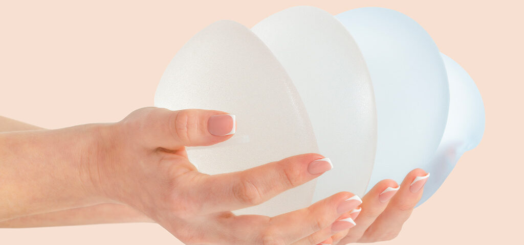 Are Breast Implants Safe? A Holistic Perspective on Chemical Exposure, image of woman holding breast implants